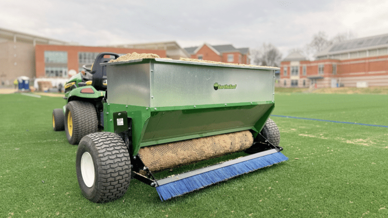 54D truflow synthetic materieals drop spreader from earth and turf