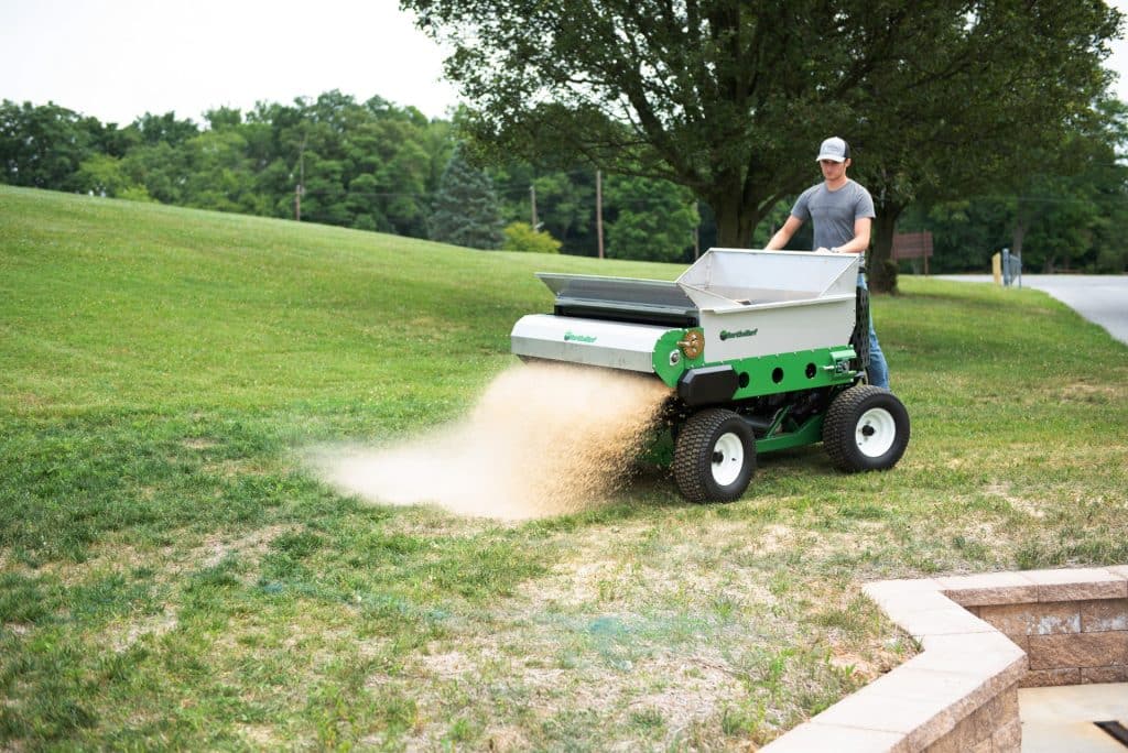 stand on sand spreader topdressing with sand