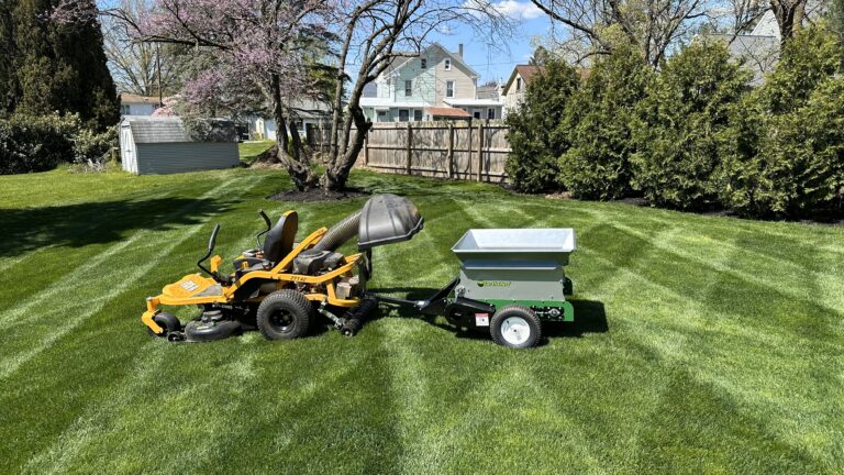 Multispread 65PT top dress spreader being pulled by a zero turn mower