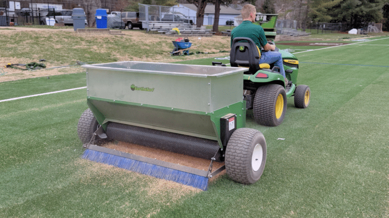 earth and turf 54D drop spreader spreading sand